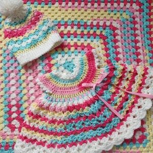 Crocheted baby blanket, dress and hat